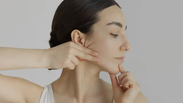 Woman doing face yoga